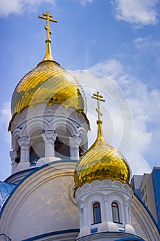 Gilding the dome of the Orthodox cathedral against the blue sky photo