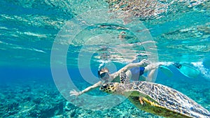 Gili Island - A man diving with turtle