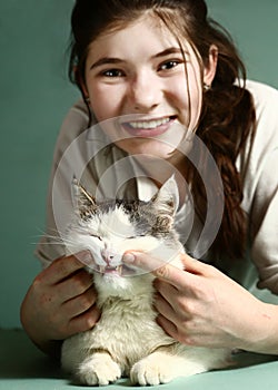 Gilr hold siberian male cat smiling