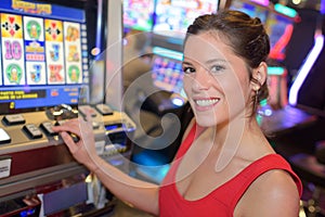 gilrs playing slot machines in casino photo