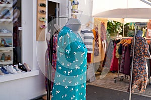 Gils dress shop mannequins in front of a women clothing store boutique