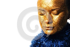 Gilt. Golden Woman`s Face Closeup. Futuristic Gilded Make-up
