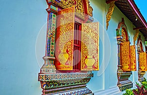 Gilt ornaments of window shutters, Viharn of Wat Chiang Man temple, Chiang Mai, Thailand