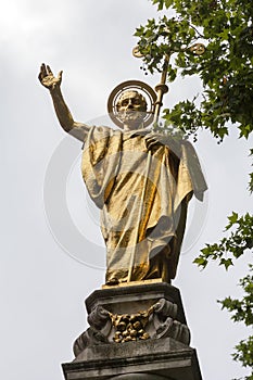 Gilt statue of Saint Paul next to the St Paul Cathedral, London, United Kingdom.