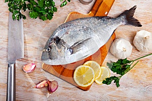 Gilthead bream with vegetables, lemon and spices