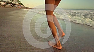 Gimbal steadycam tracking shot of happy and excited Asian Indonesian child girl running carefree on the beach