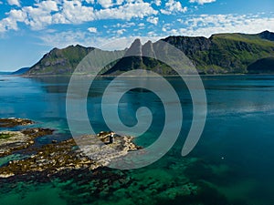 Gimsoy lighthouse on sea rocks, Lofoten Norway