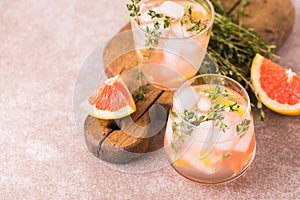 Gin bitter lemon with thyme and grapefruit. Fruit lemonade.