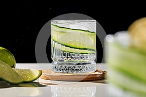 gin tonic with a slice of fresh cucumber