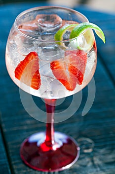 Gin tonic with strawberries. photo