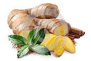 Giner root next to pile of cinnamon sticks,  mint leaves and ground cinnamon isolated