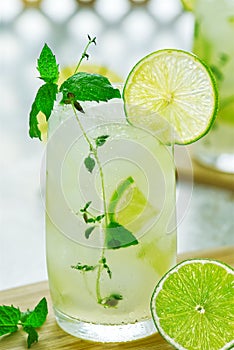 Ginger Ale or Kombucha in glass Homemade cocktail lime and ginger limonade. Indian drink to refresh