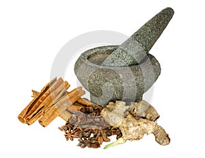 Ginger, cinnamon and star anise with stone pounder photo