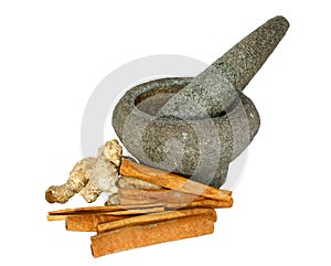 Ginger and cinnamon with stone pounder photo