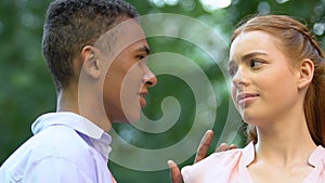 Ginger girl rejecting kiss from black boy, biased attitude to race differences