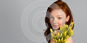 Ginger-Haired Young Female Posing With Plant In Studio, Panorama