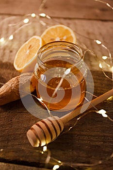 Ginger, honey and lemon, the concept of natural medicine, holiday garland, warm woolen socks, winter cozy home concept