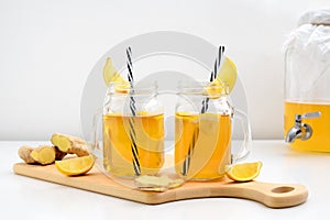 Ginger and lemon combucha detox drink in two jars