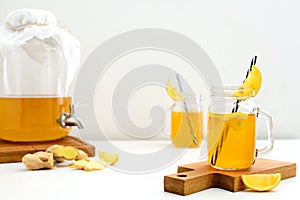 Ginger and lemon combucha detox drink in two jars