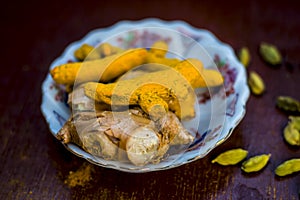 Ginger ,MANGO GINGER/WHITE GINGER with green cardamom in a glass plate for the medicines.