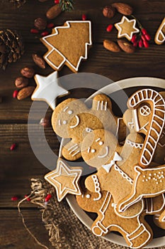 Ginger men on a wooden background.. Christmas cookies