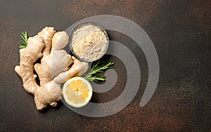 Ginger root, ginger powder and lemon on vintage background