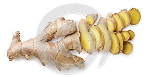 Ginger root sliced into pieces on white. Top view