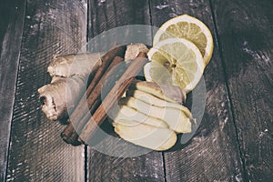 Ginger root sliced on wooden table