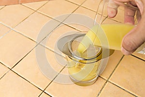 Ginger roots juice being sieved after extraction