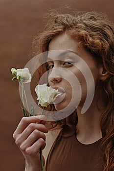 Ginger sensual girl with flower