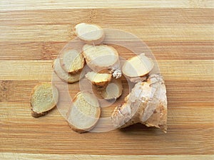 Ginger slice heap on wooden background