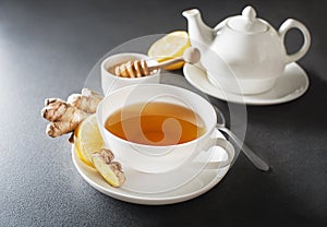 Ginger tea with fresh ginger root and lemon