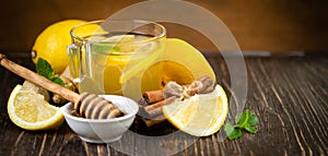 Ginger tea and ingredients - lemon, cinnamon, honey