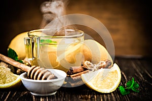 Ginger tea and ingredients - lemon, cinnamon, honey