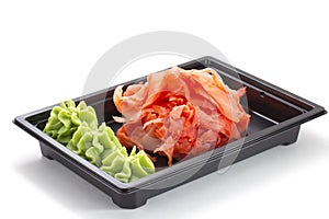 Ginger and wasabi in bento box isolated