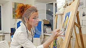 Ginger woman in apron painting watercolor still life