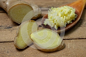 Ginger on a wooden background. Chopped ginger root. Healthy food