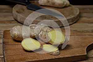 Ginger on a wooden background. Chopped ginger root. Healthy food