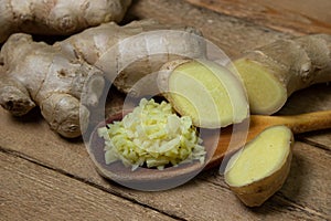 Ginger on a wooden background. Chopped ginger root. Healthy food