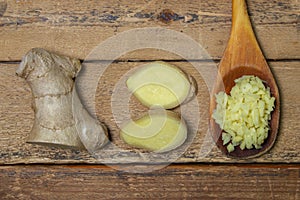 Ginger on a wooden background. Chopped ginger root. Healthy food