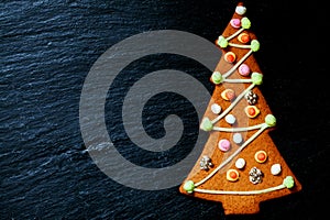 Gingerbread Christmas tree on black with space for text