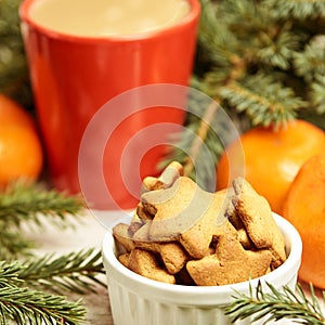 Gingerbread Cookie. Cup of coffee. Spruce branch. Orange tangerines. NewYear