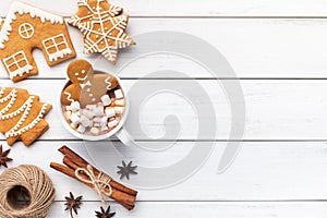 Gingerbread cookie man in cup of hot chocolate