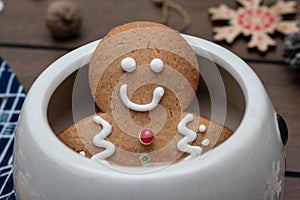 Gingerbread cookie man in a hot tea mug