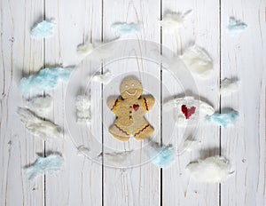 Gingerbread cookie men among the clouds, on the white background