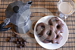 Gingerbread cookies in chocolate with hot coffee