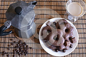 Gingerbread cookies in chocolate with hot coffee