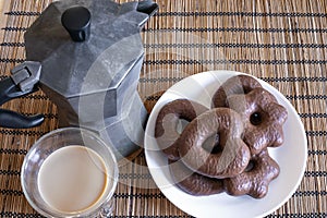 Gingerbread cookies in chocolate with hot coffee