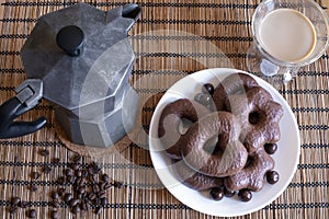 Gingerbread cookies in chocolate with hot coffee