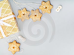 Gingerbread cookies and gift box Christmas background.